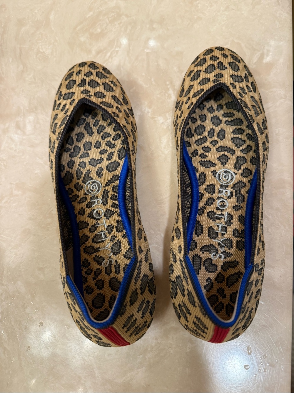 Rothy's Leopard Print Ballet Flats with Blue Trim and Red Heel Accent